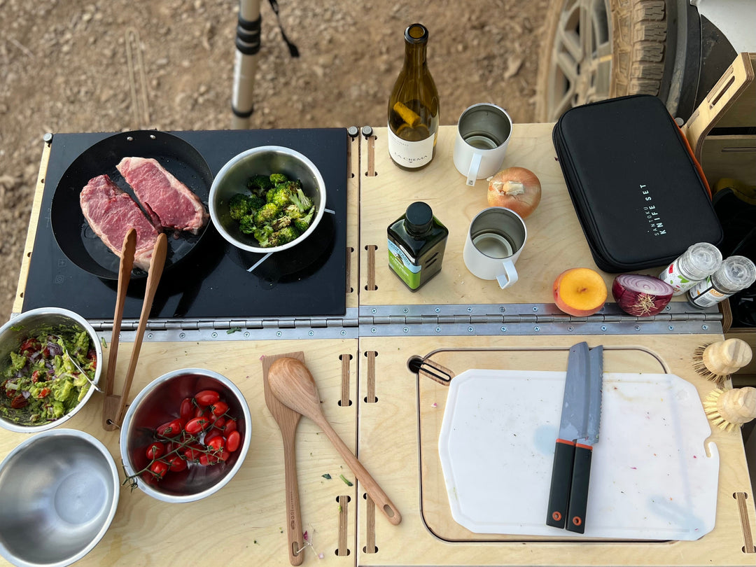 Rivian R1T Camp Kitchen with food being cooked